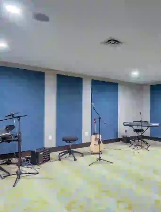 Music room showing keyboard, guitar, and electronic drums