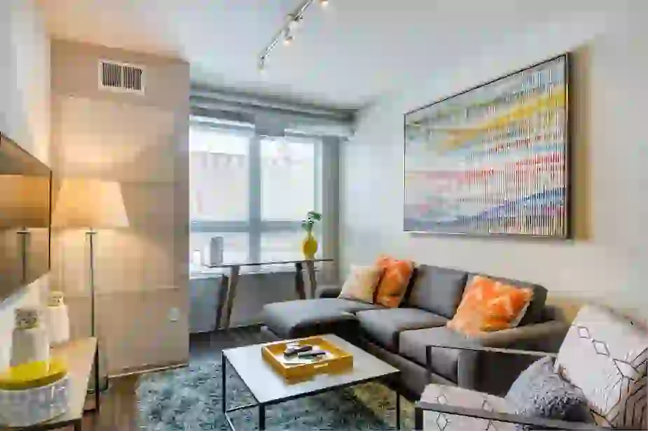 Living room with exposed HVAC ducts