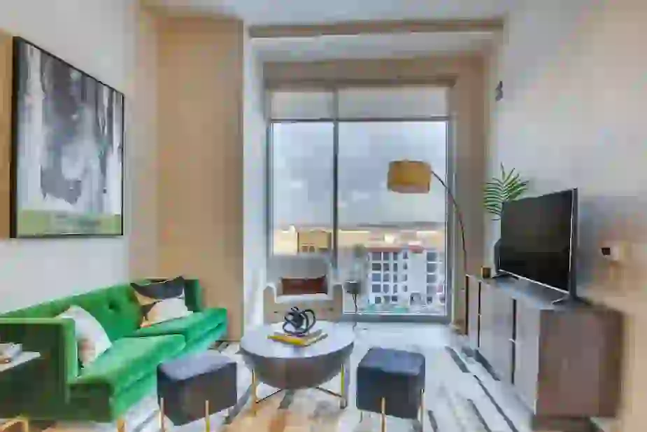 Large windows in living room showing a view of the Prospect Park neighborhood in Minneapolis