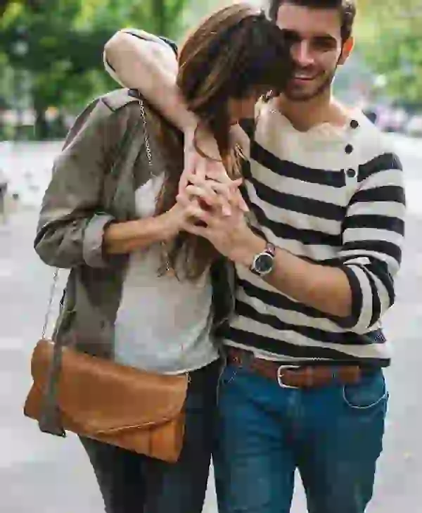 Couple embracing while strolling through Downtown Minneapolis